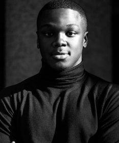 A black and white headshot of Owen Chaponda