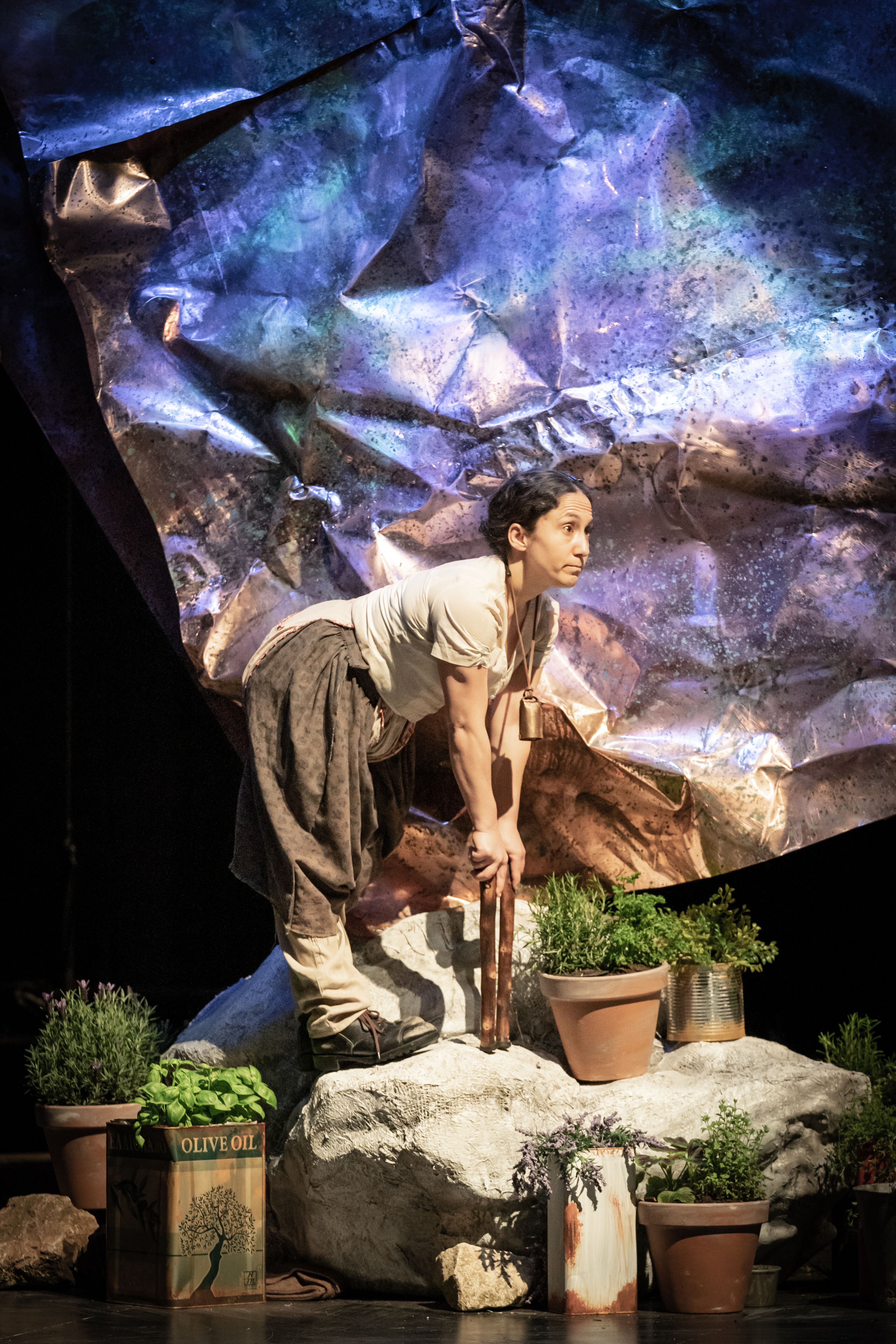 Cast members on stage digging up her garden