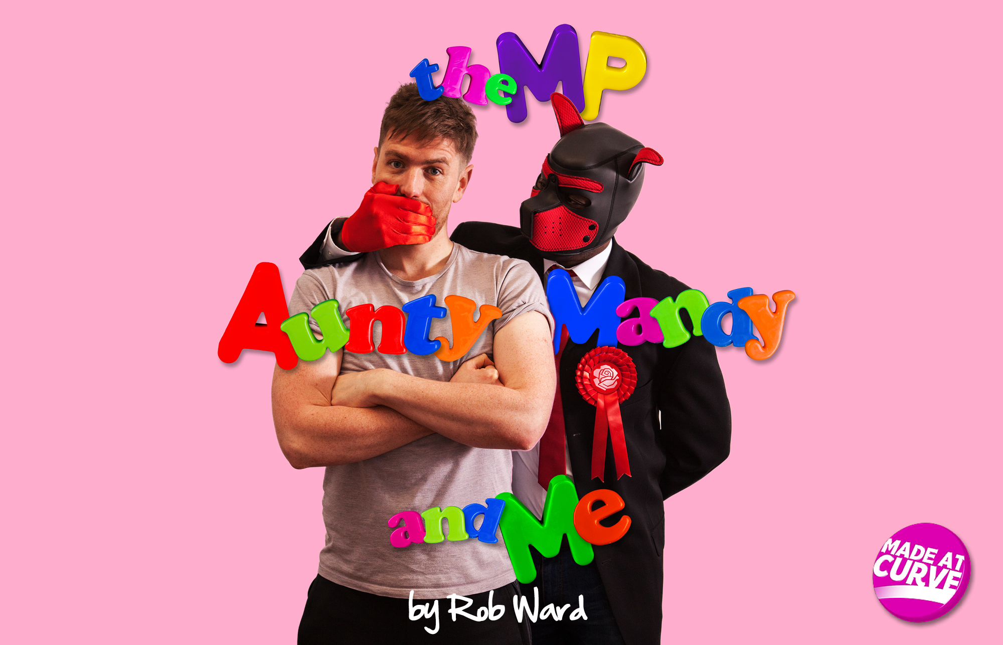 Rob Ward as Dom has his mouth covered from behind by a person wearing a leather dog mask, red silk gloves, a suit and a red rosette. Fridge magnet letters read The MP, Aunty Mandy and Me against a pink background.