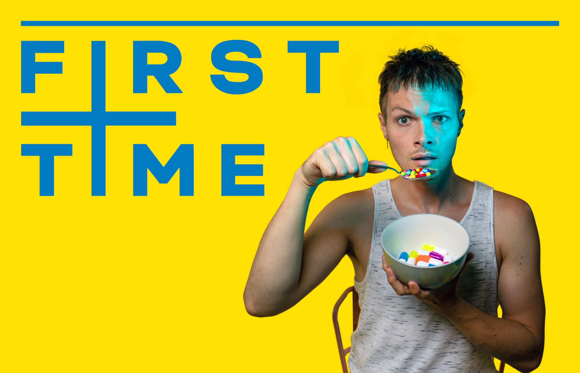 Nathaniel Hall looks into the camera, confused, wearing a white vest. A blue light is cast on his face from the right as he eats a bowl of pills. The background is yellow with blue text that reads FIRST TIME.