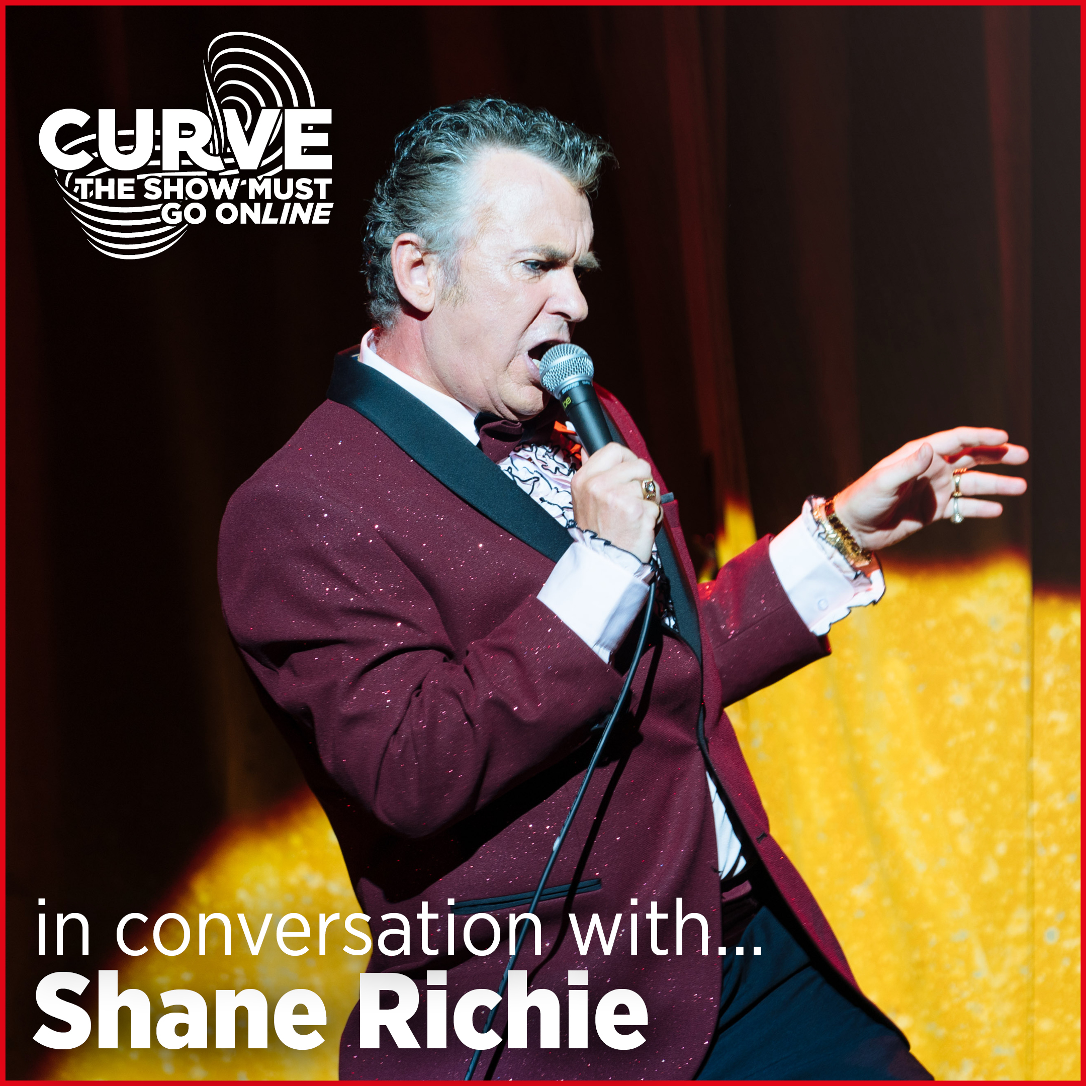 Shane Richie as Archie Rice in The Entertainer, speaking into a microphone.