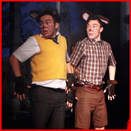 Bruno (Kieran Urquhart) and Boy (Fox Jackson-Keen) sneak around the set as boy mice, in a production image from The Witches.